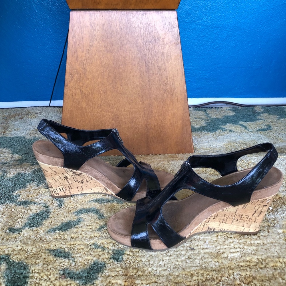 Wedge, black leather sandals.
